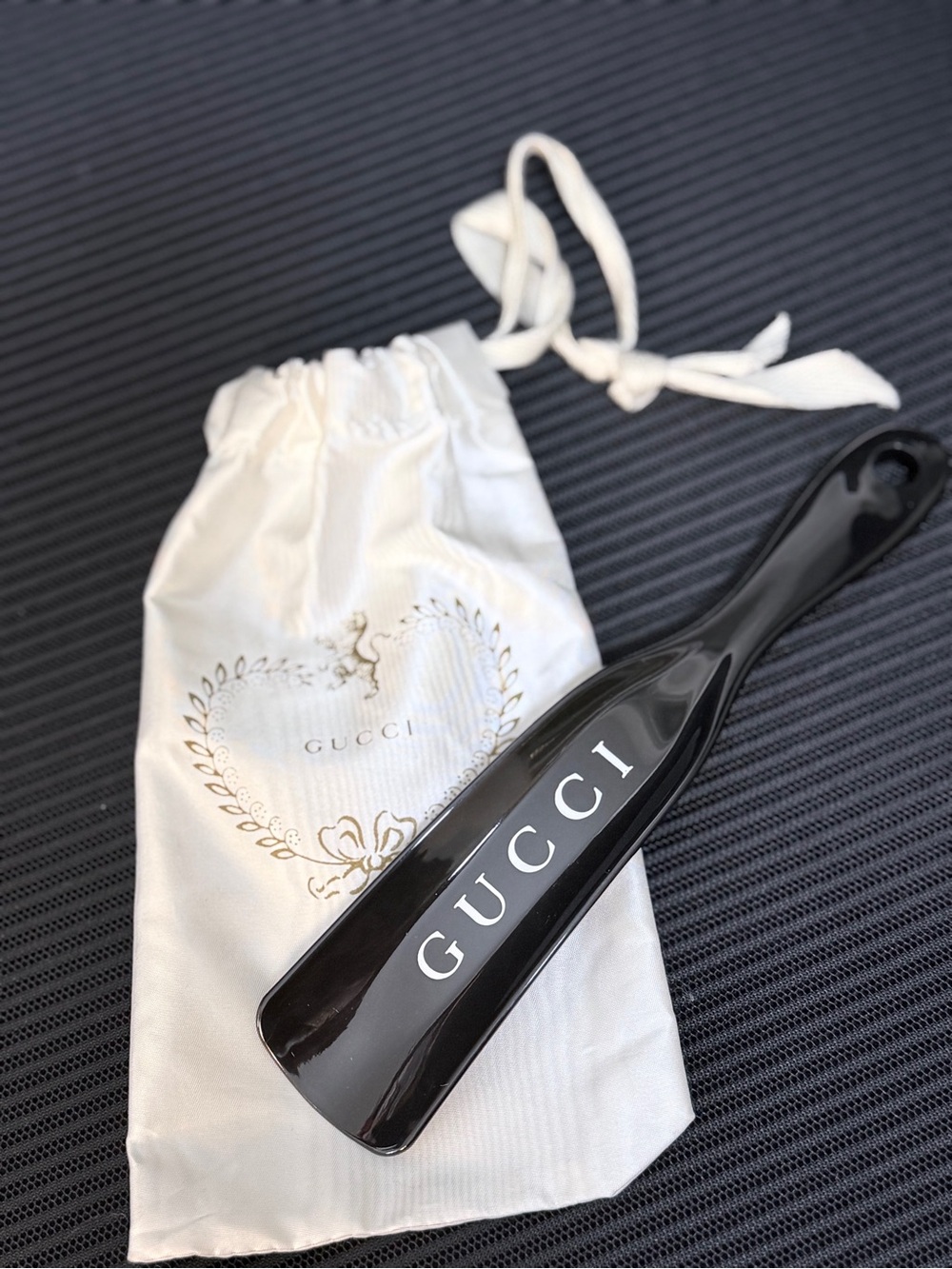 Gucci Black Lacquer Shoe Horn with White Branded Dust Bag